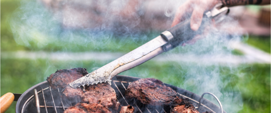 Stock photo of someone grilling from canva for our Spring Checklist blog post.
